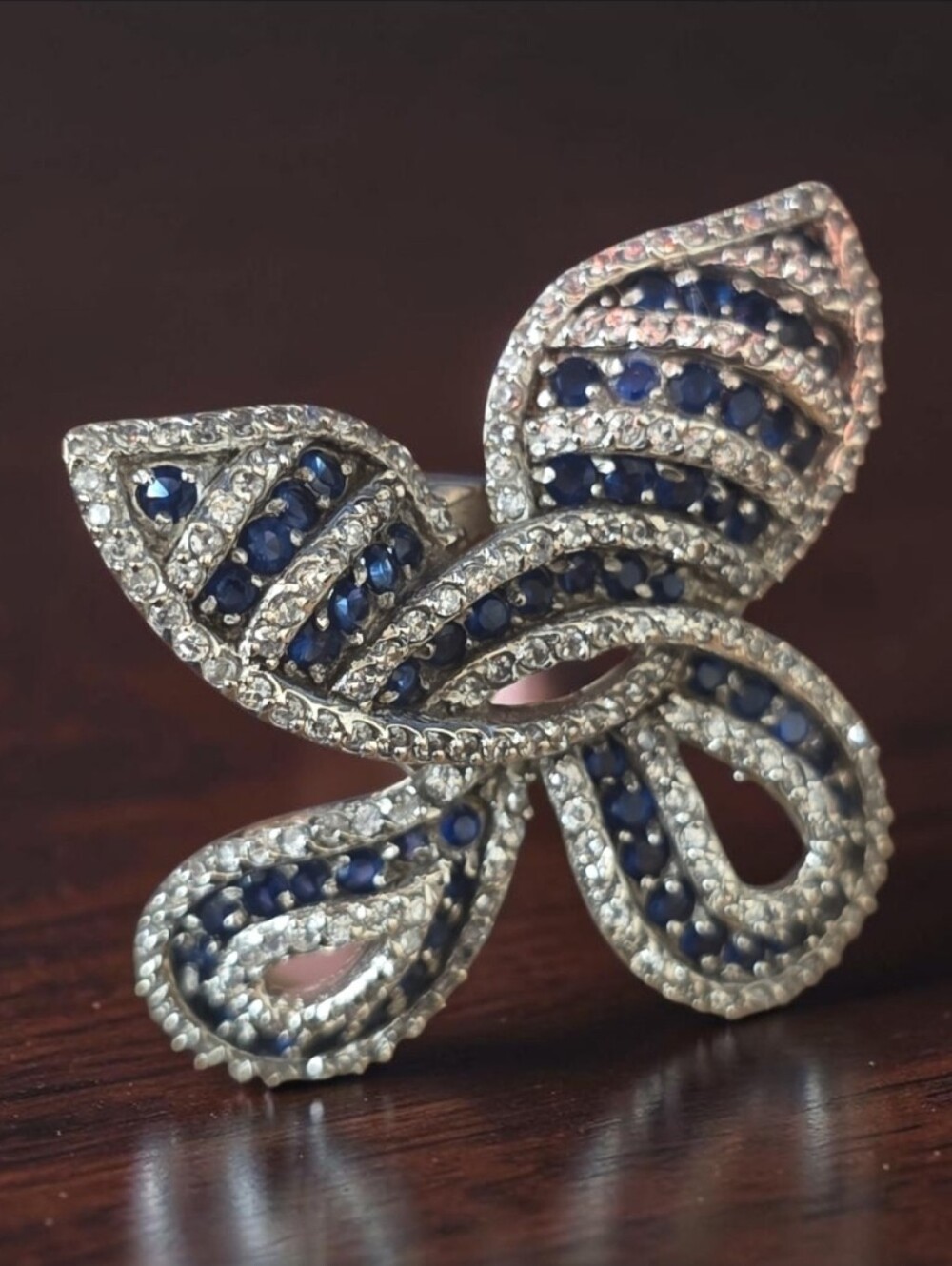 Blue Sapphire and white cubic zirconia pavé butterfly ring. Size 7